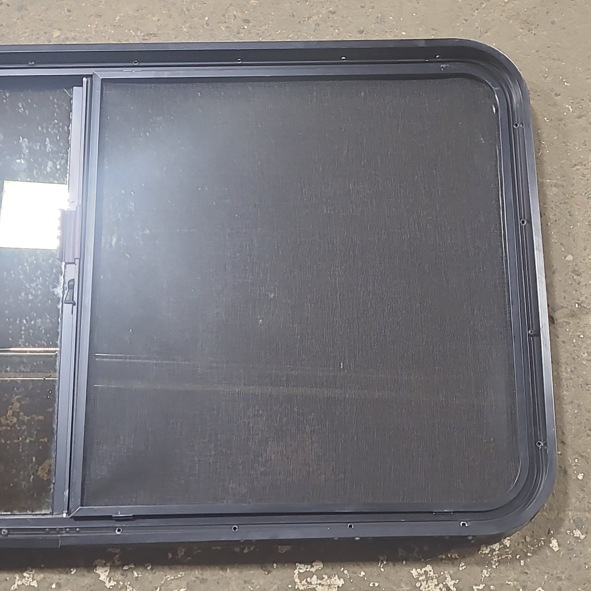 Used Black Radius Opening Window : 48 1/2" W x 261/4" H x 1 3/4" D - Young Farts RV Parts
