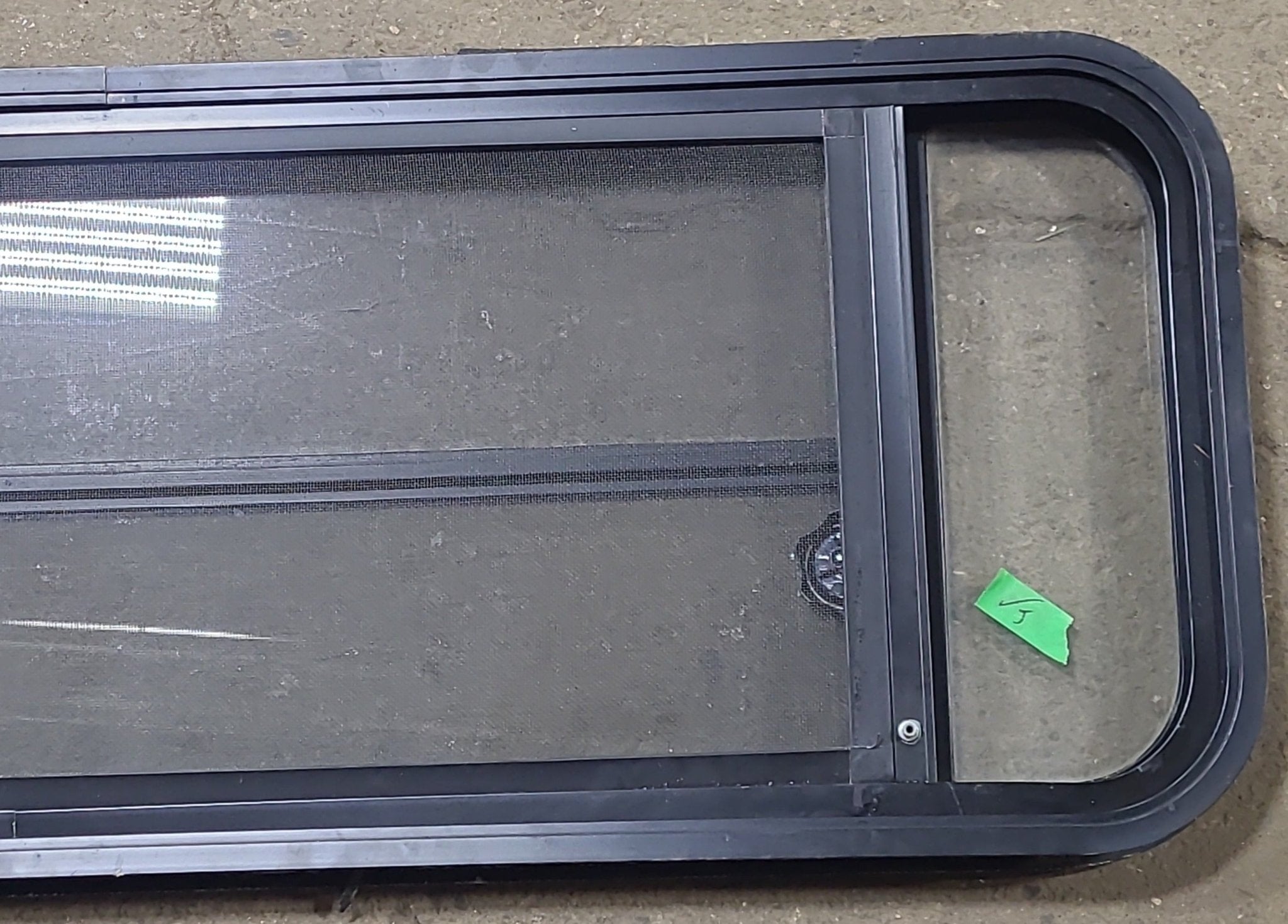 Used Black Radius Opening Window : 48 3/4" W x 16 1/2" H x 1 5/8" D - Young Farts RV Parts