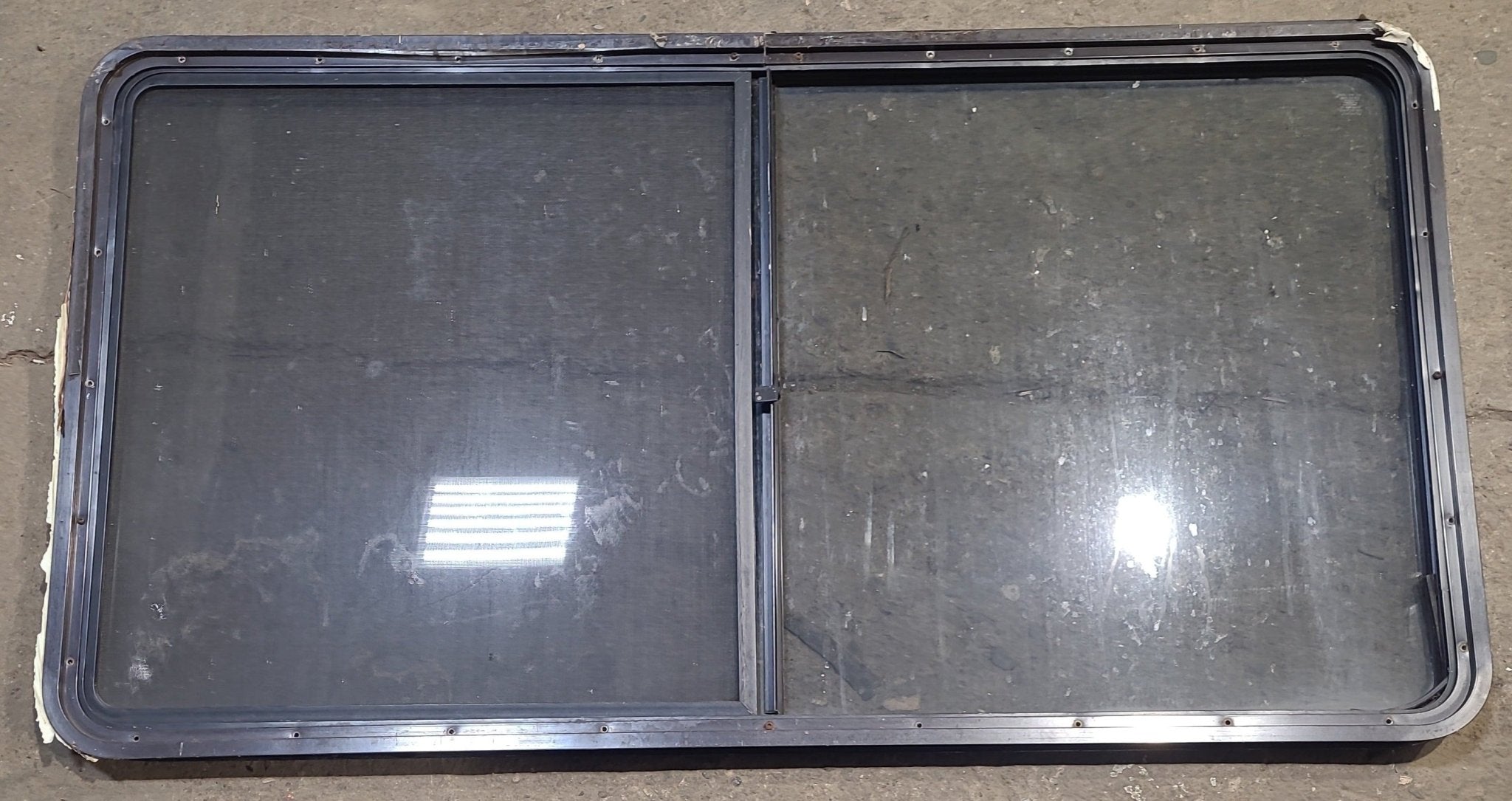 Used Black Radius Opening Window : 57" W x 27 3/4" H x 1 7/8" D - Young Farts RV Parts