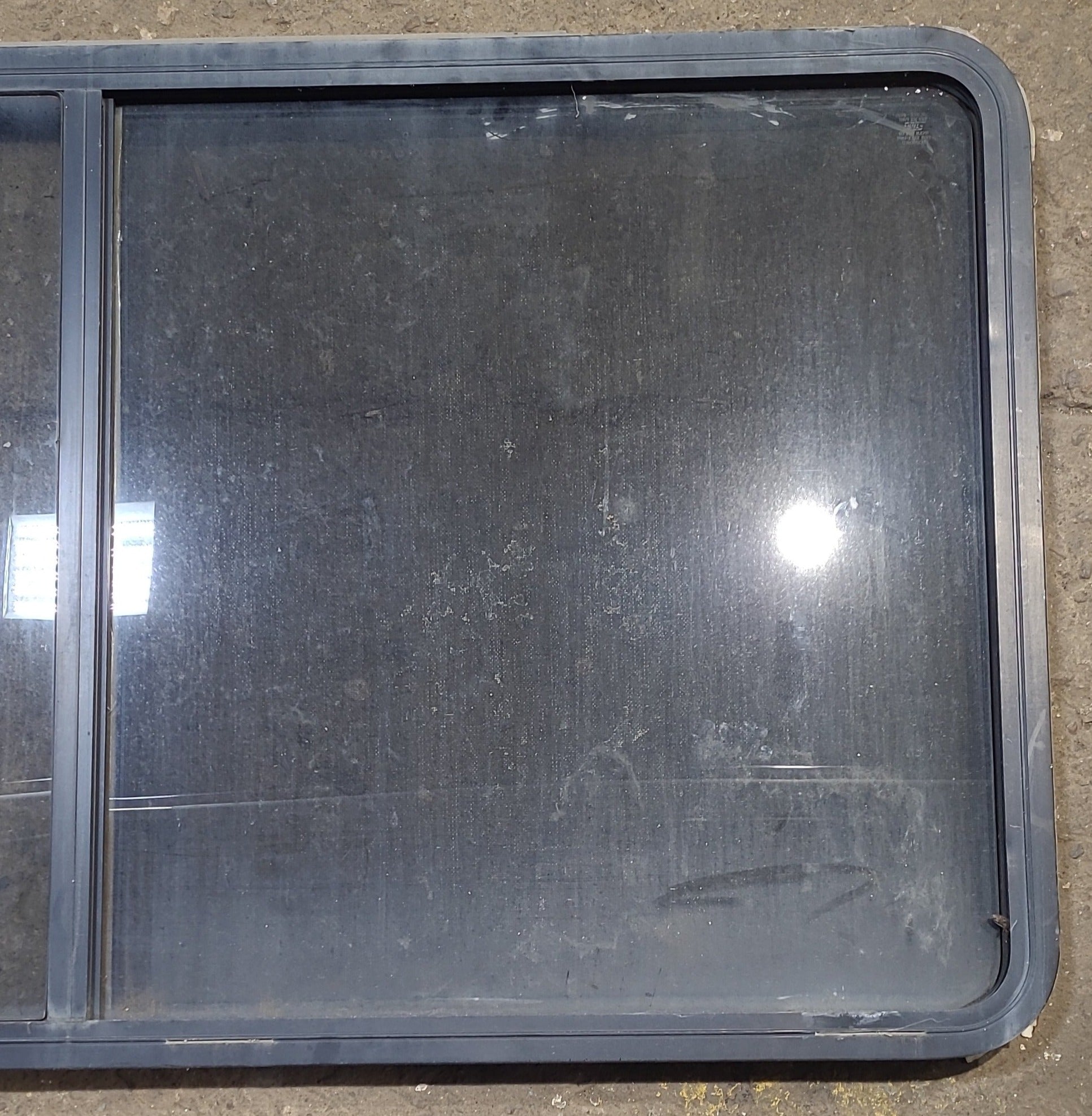 Used Black Radius Opening Window : 57" W x 27 3/4" H x 1 7/8" D - Young Farts RV Parts