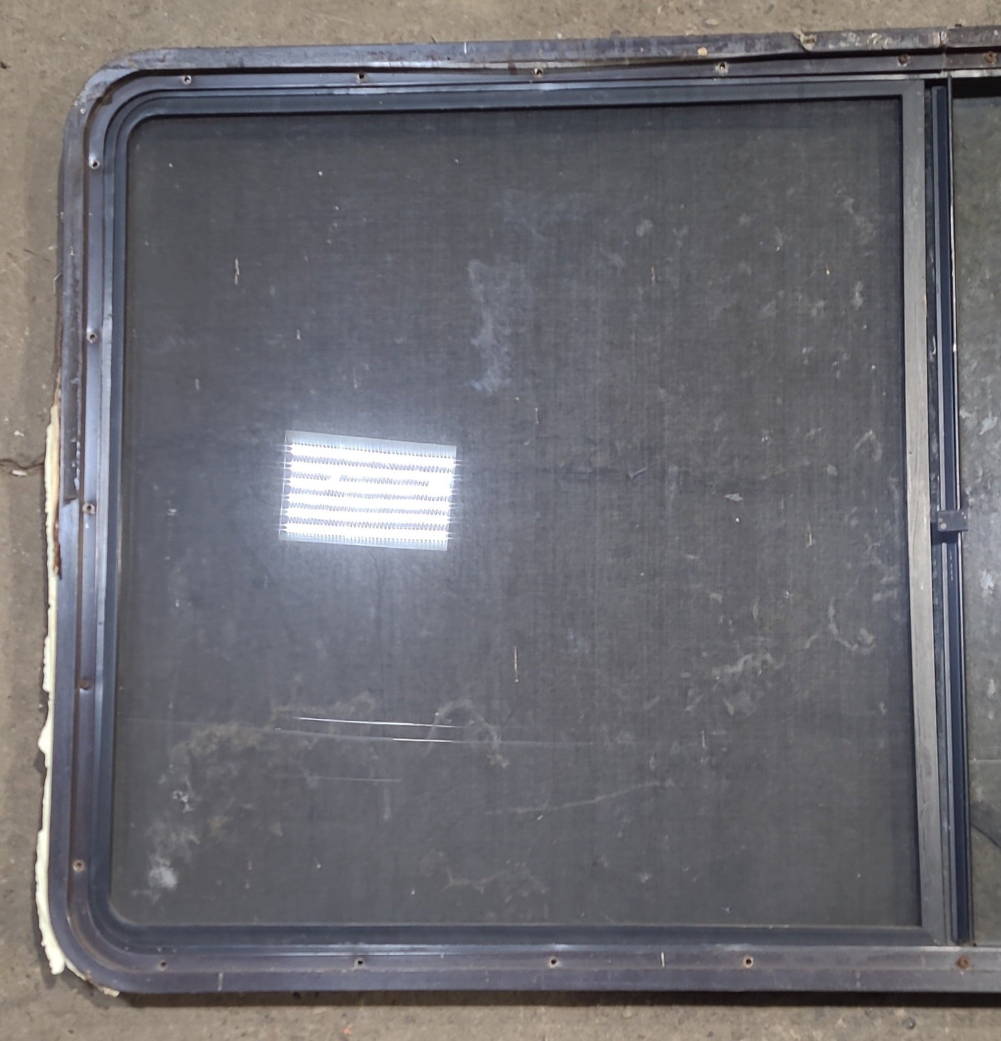 Used Black Radius Opening Window : 57" W x 27 3/4" H x 1 7/8" D - Young Farts RV Parts