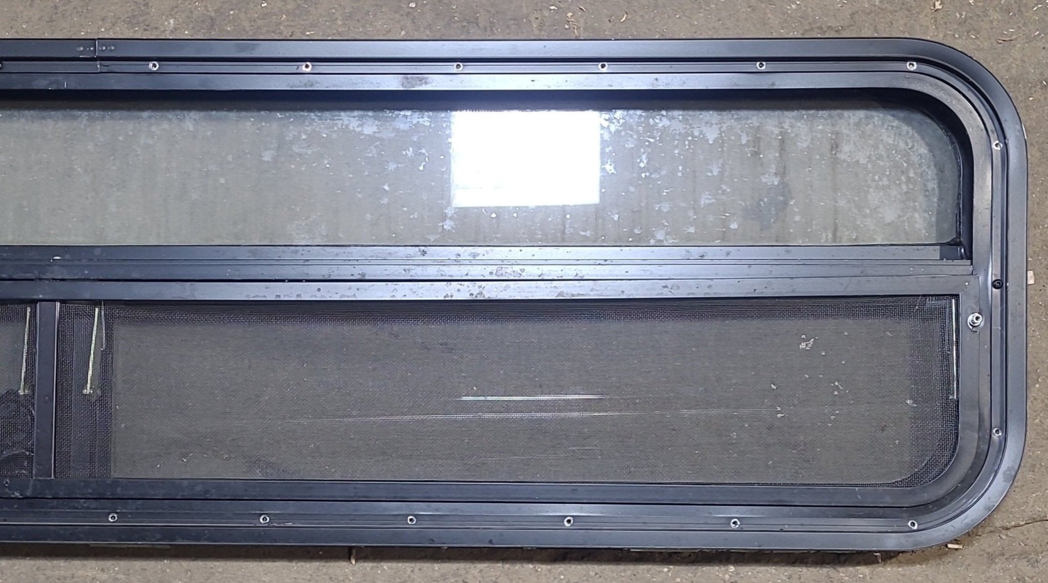 Used Black Radius Opening Window : 59 1/4" W x 14 1/2" H x 1 7/8" D - Young Farts RV Parts