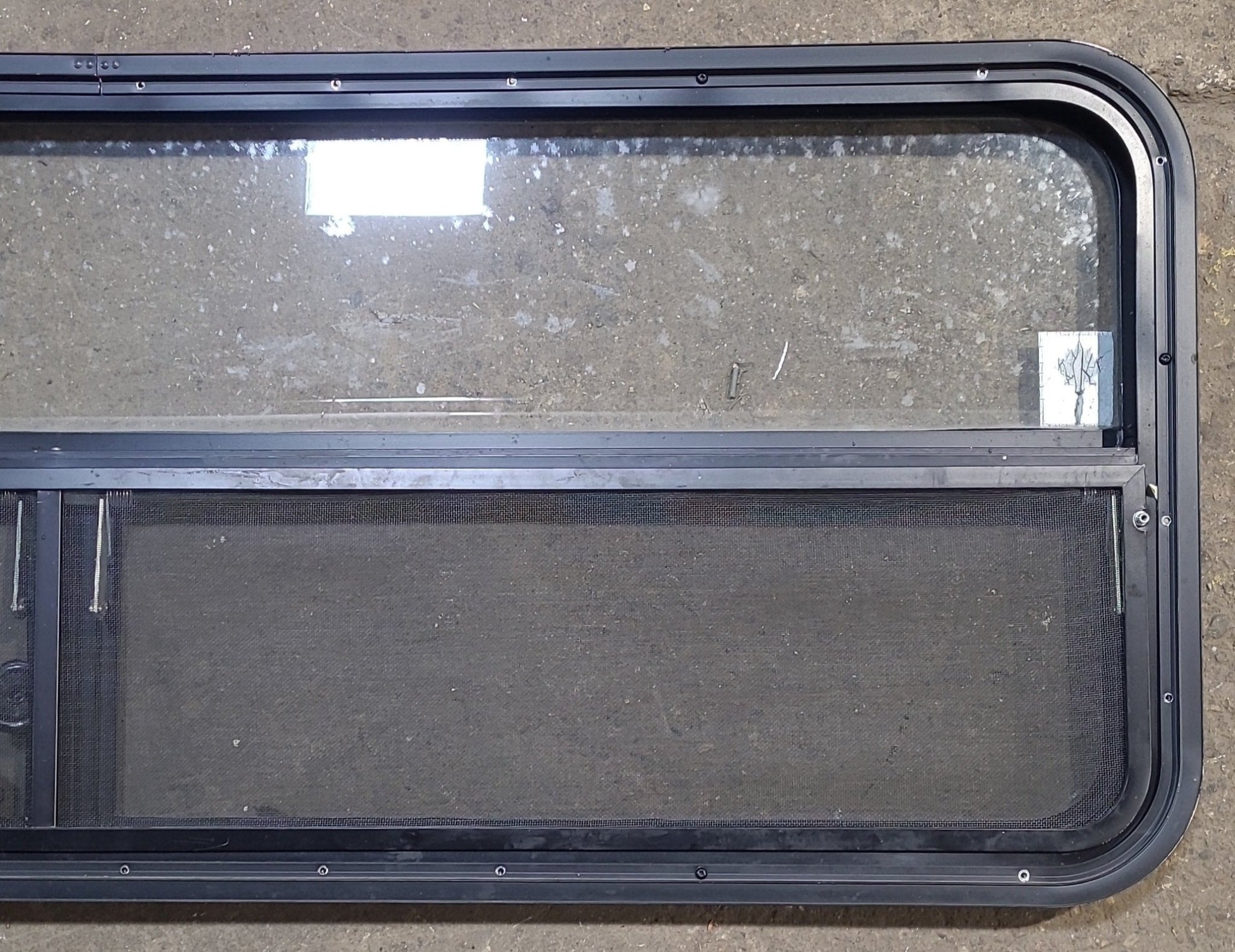 Used Black Radius Opening Window : 59 1/4" W x 21 1/4" H x 1 7/8" D - Young Farts RV Parts