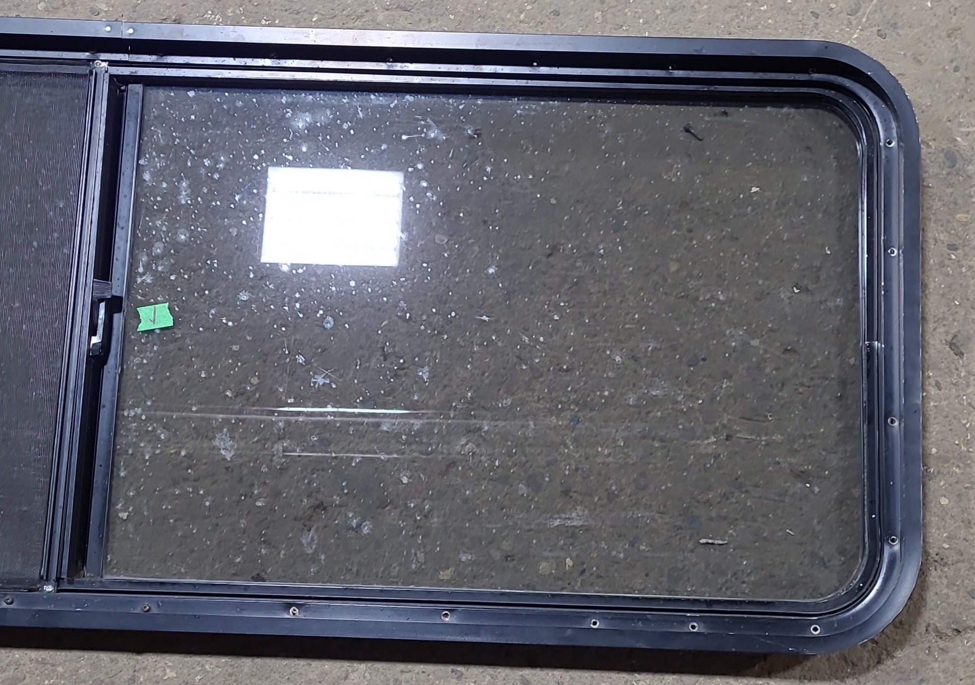 Used Black Radius Opening Window : 60 1/4" W x 21 3/4" H x 1 3/4" D - Young Farts RV Parts