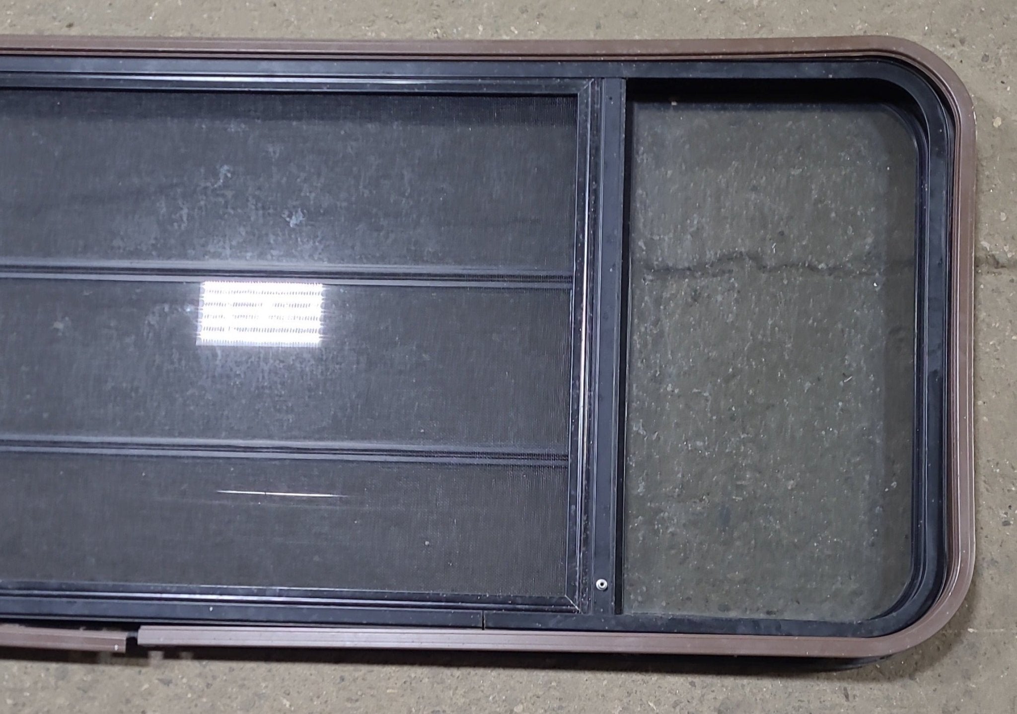 Used Black Radius Opening Window : 60 3/4" W x 23" H x 1 1/2" D - Young Farts RV Parts