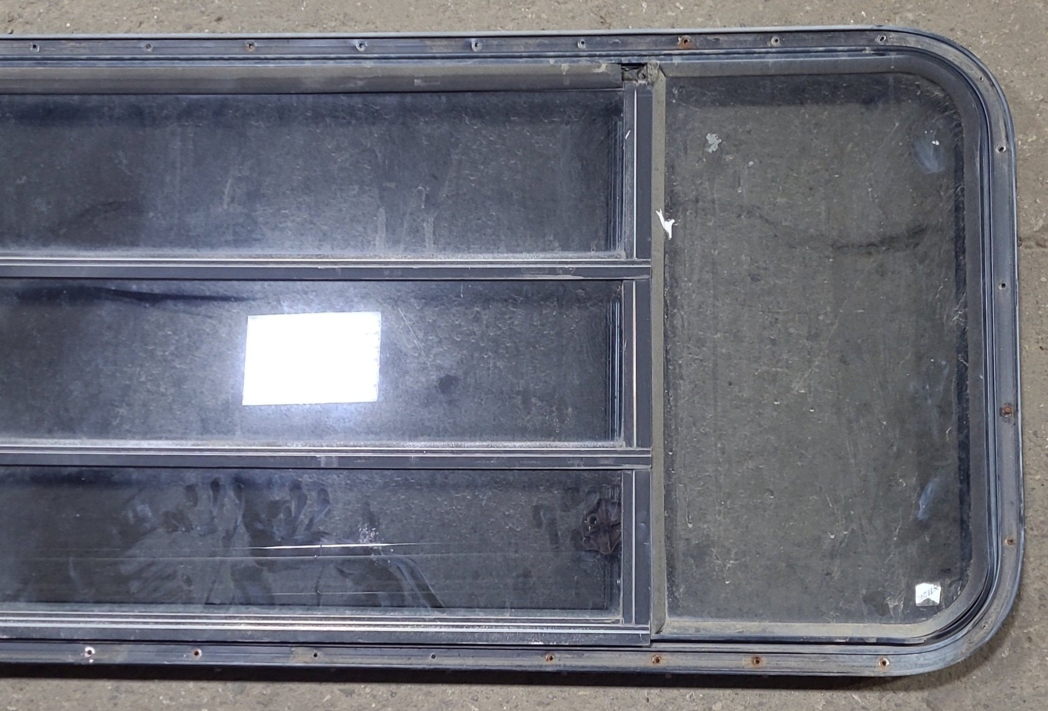 Used Black Radius Opening Window : 60 3/4" W x 23" H x 1 1/2" D - Young Farts RV Parts