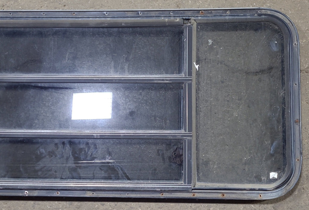 Used Black Radius Opening Window : 60 3/4" W x 23" H x 1 1/2" D - Young Farts RV Parts