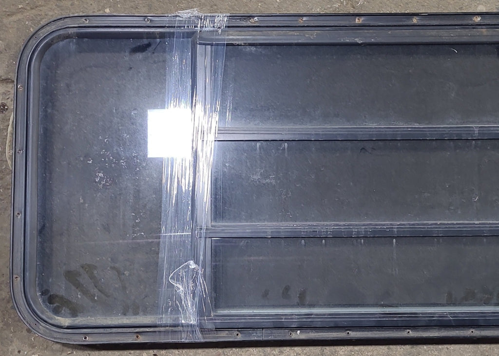 Used Black Radius Opening Window : 60 3/4" W x 23" H x 1 3/8" D - Young Farts RV Parts