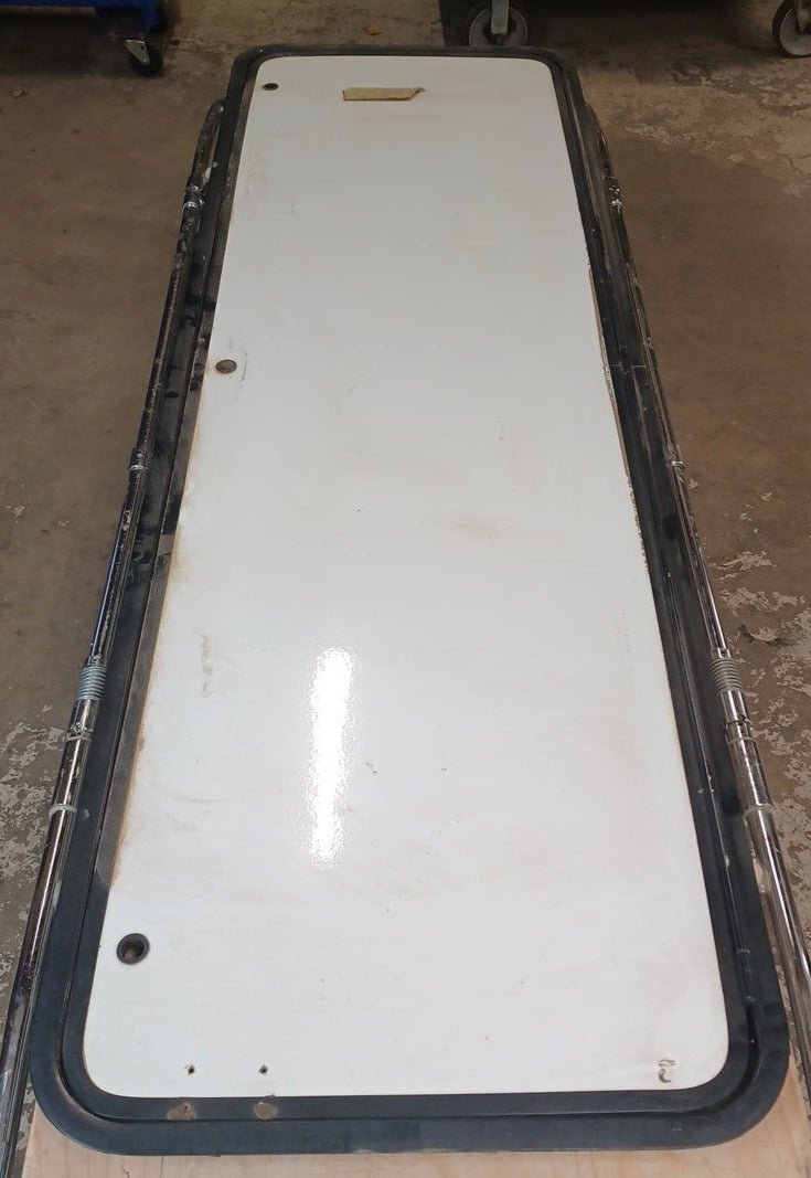 Used Radius Cornered Cargo Door 69 5/8" x 21 7/8" x 2" D - Young Farts RV Parts