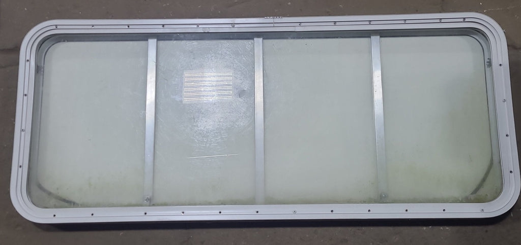 Used Radius Opening Rock Guard Covered Window : 53 1/4" x 21 1/4" X 1 3/4" D - Young Farts RV Parts