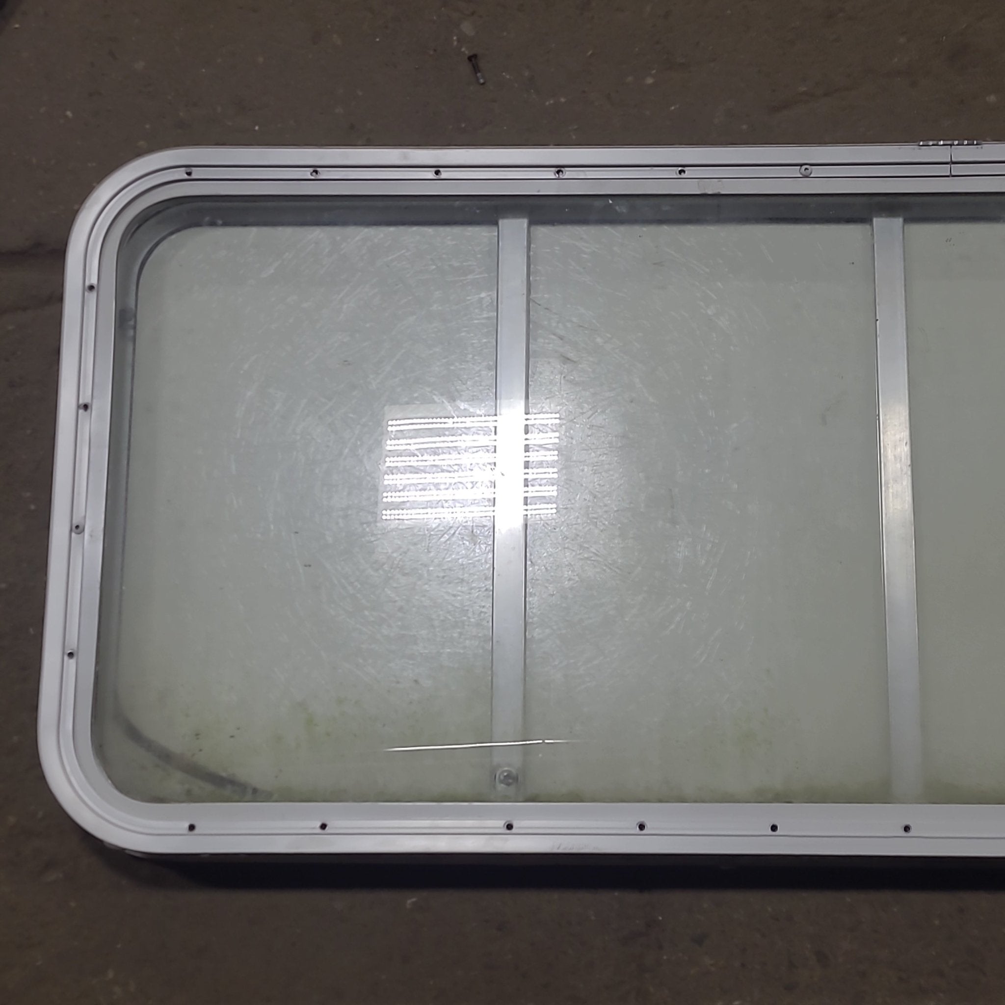 Used Radius Opening Rock Guard Covered Window : 53 1/4" x 21 1/4" X 1 3/4" D - Young Farts RV Parts