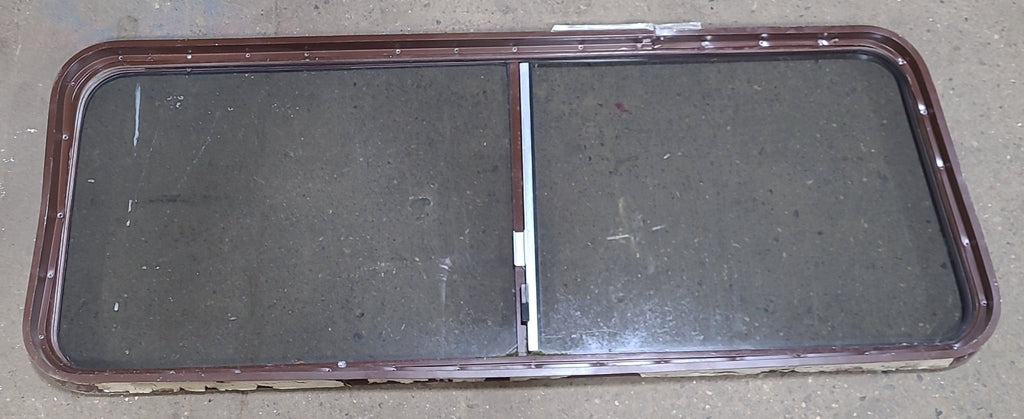 Used Slanted Brown Radius Opening Window : 22 1/8" H X 58 3/4" W X 2" D - Young Farts RV Parts