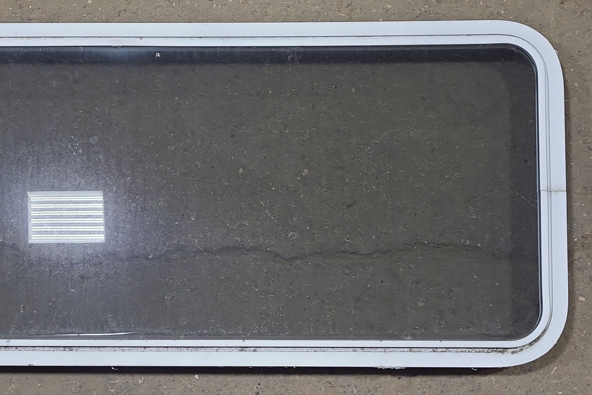 Used White Radius Non Opening Window : 54 1/4" W x 21 3/4" H x 1 7/8" D - Young Farts RV Parts