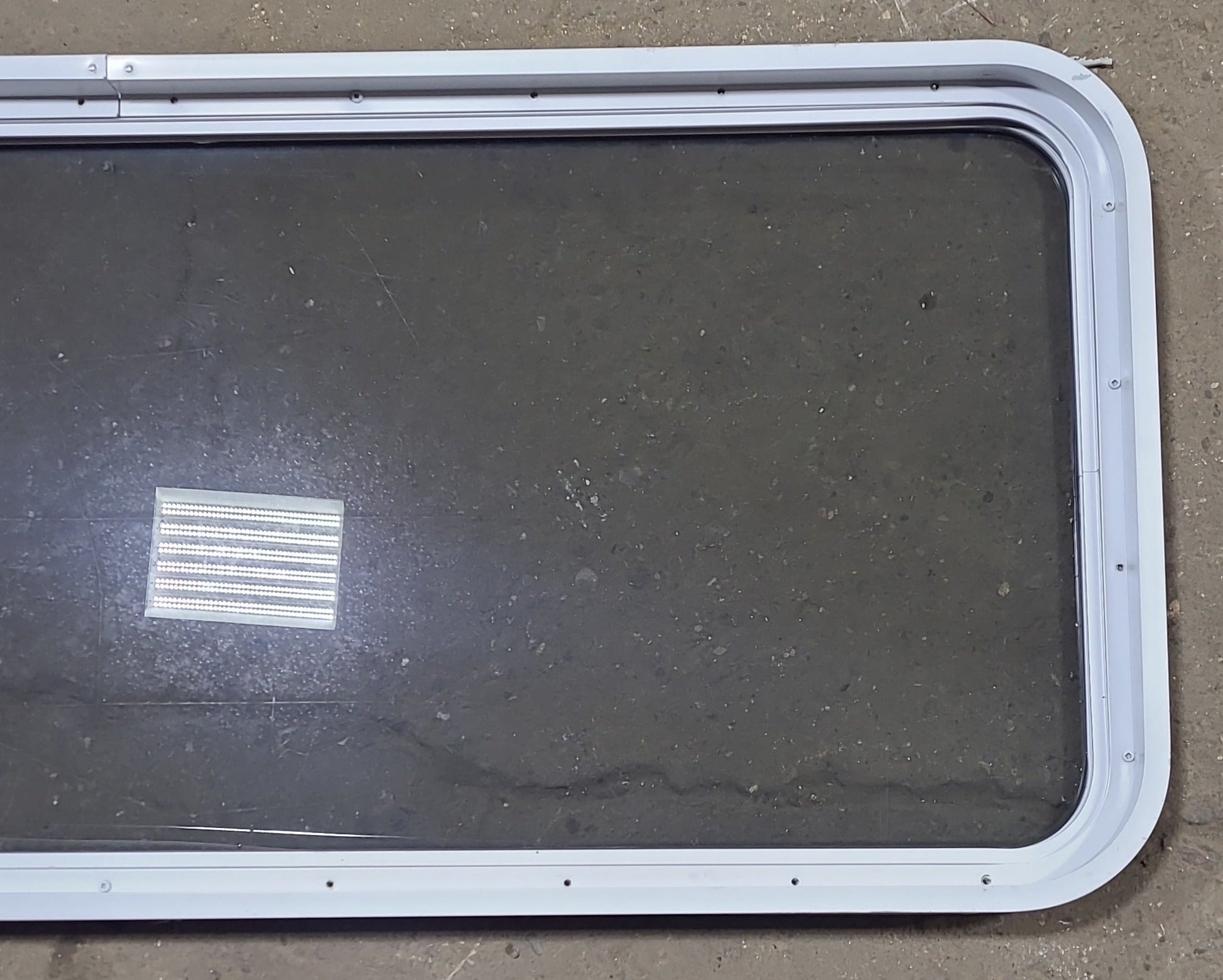 Used White Radius Non Opening Window : 54 1/4" W x 21 3/4" H x 1 7/8" D - Young Farts RV Parts